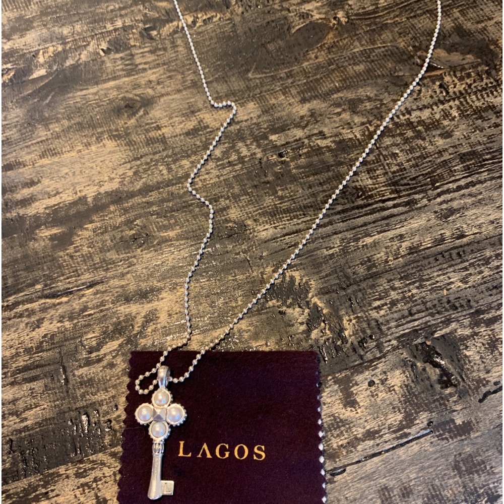 Lagos key pendant with pearl accent on 32” ball chain.